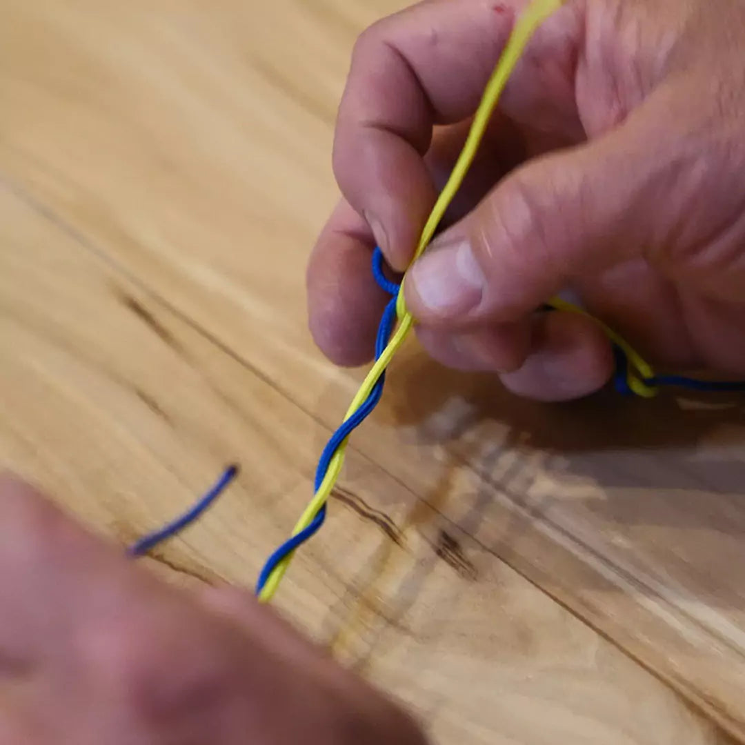 Fly Fisherman Demonstrating a Blood Knot