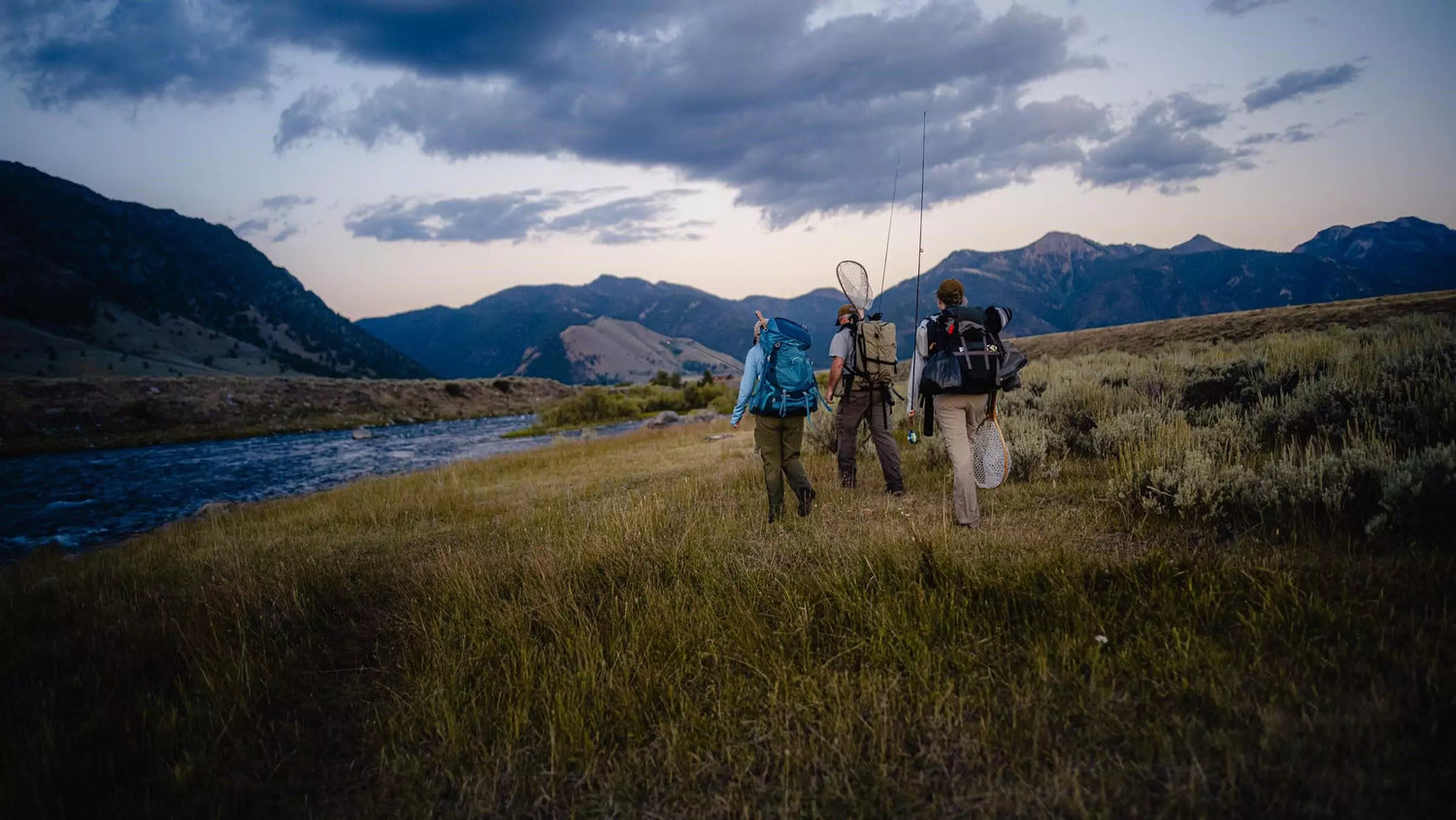 Three Fly Fishermen with Fly Rods and Backpacks