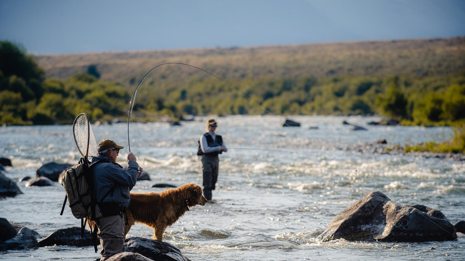 Fly Fishermen in a River Fishing with the Best Rods by Montana Casting Co.
