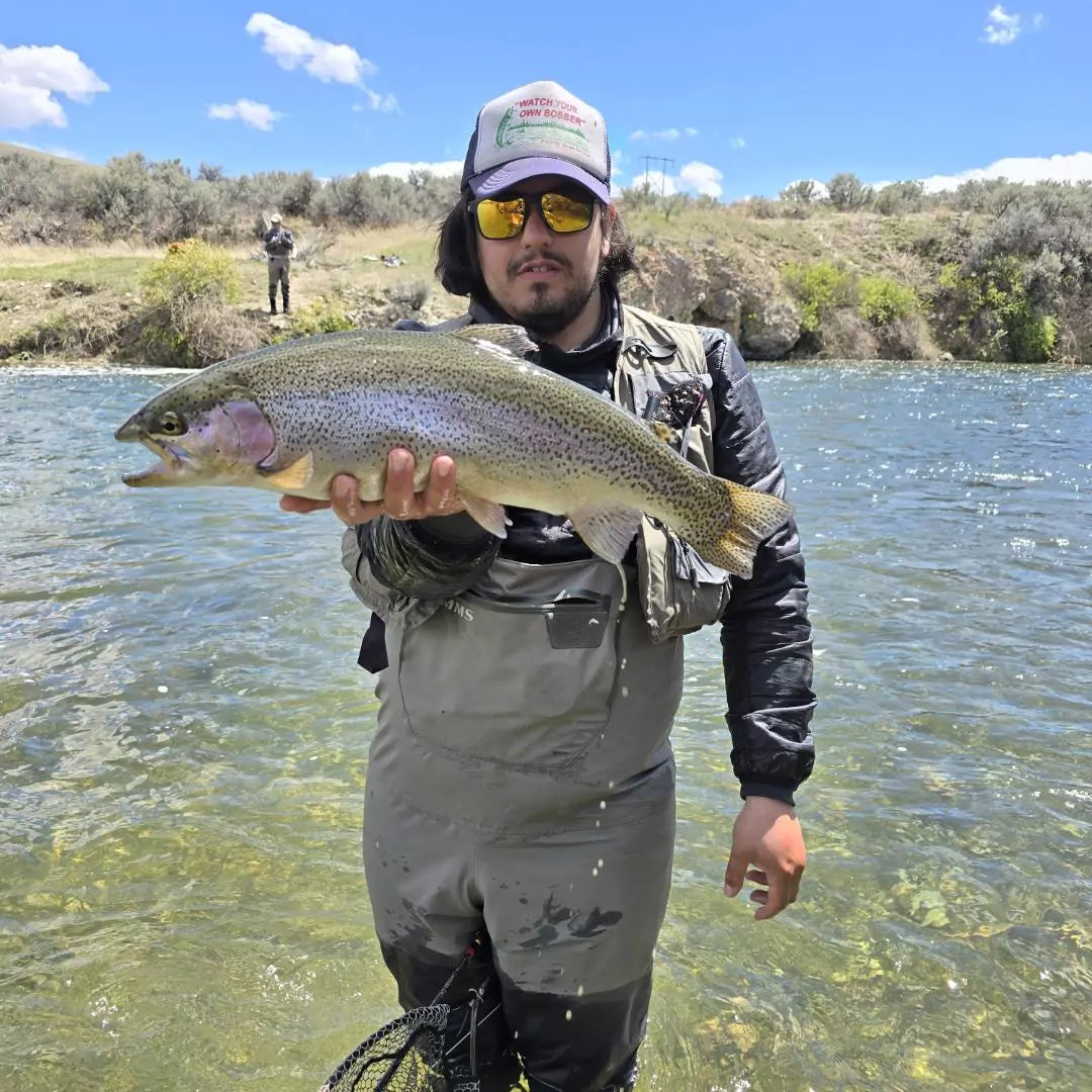 Fly Fisherman with a Rainbow Trout