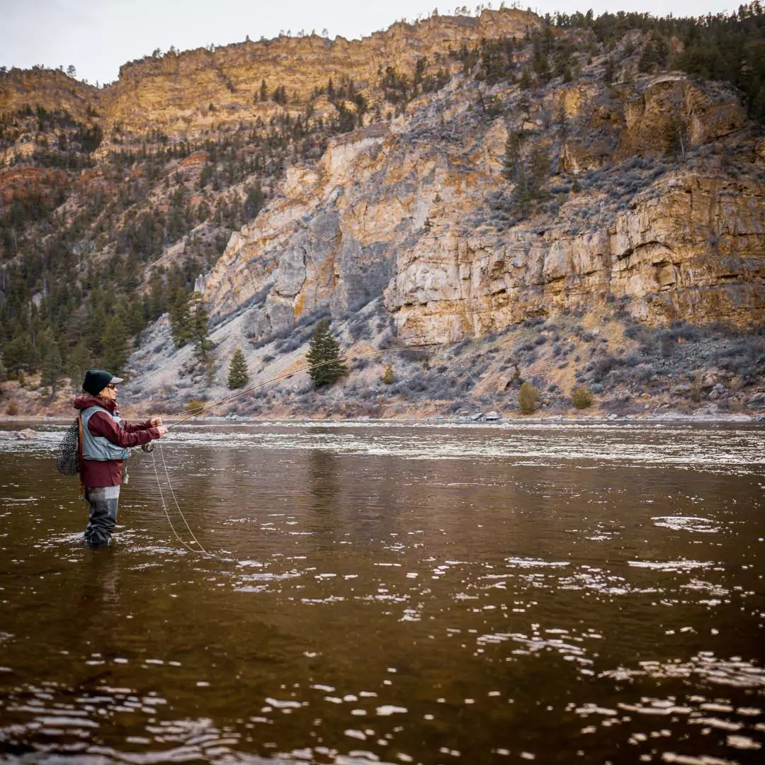 Woman Using a Fly Rod with Fly Line Hanging Down