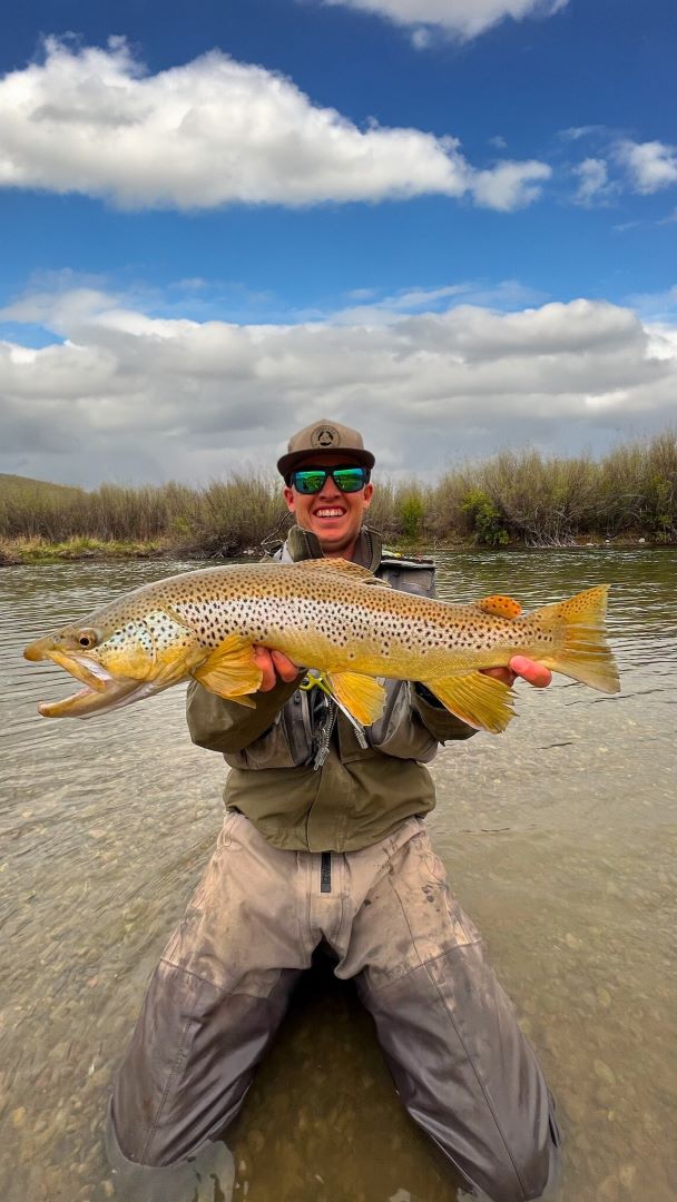 Staiger Joyner holds a Trophy Brown Trout